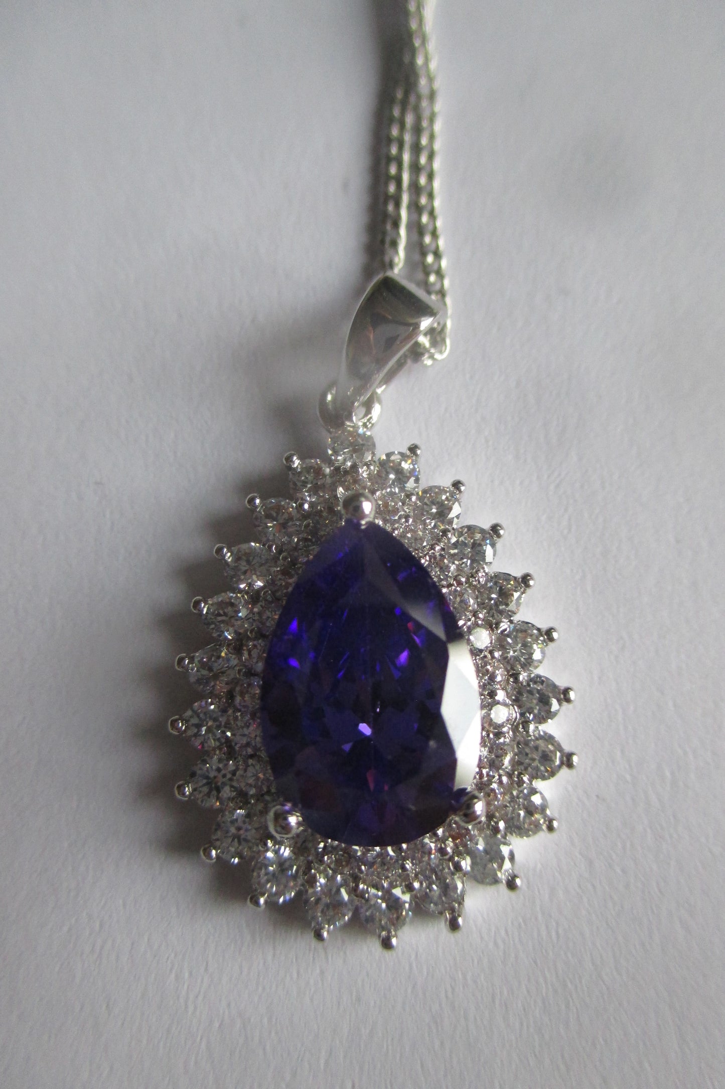 Pear violet stone silver pendant