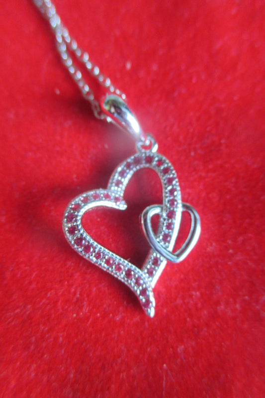 Silver hearts with red accents pendant