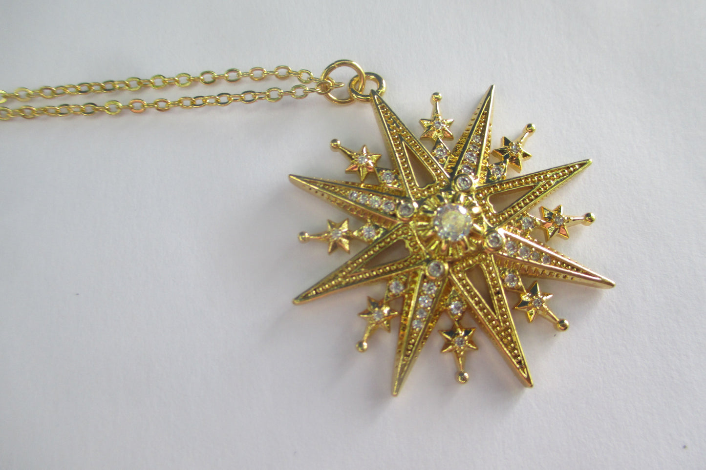 Gold star pendant