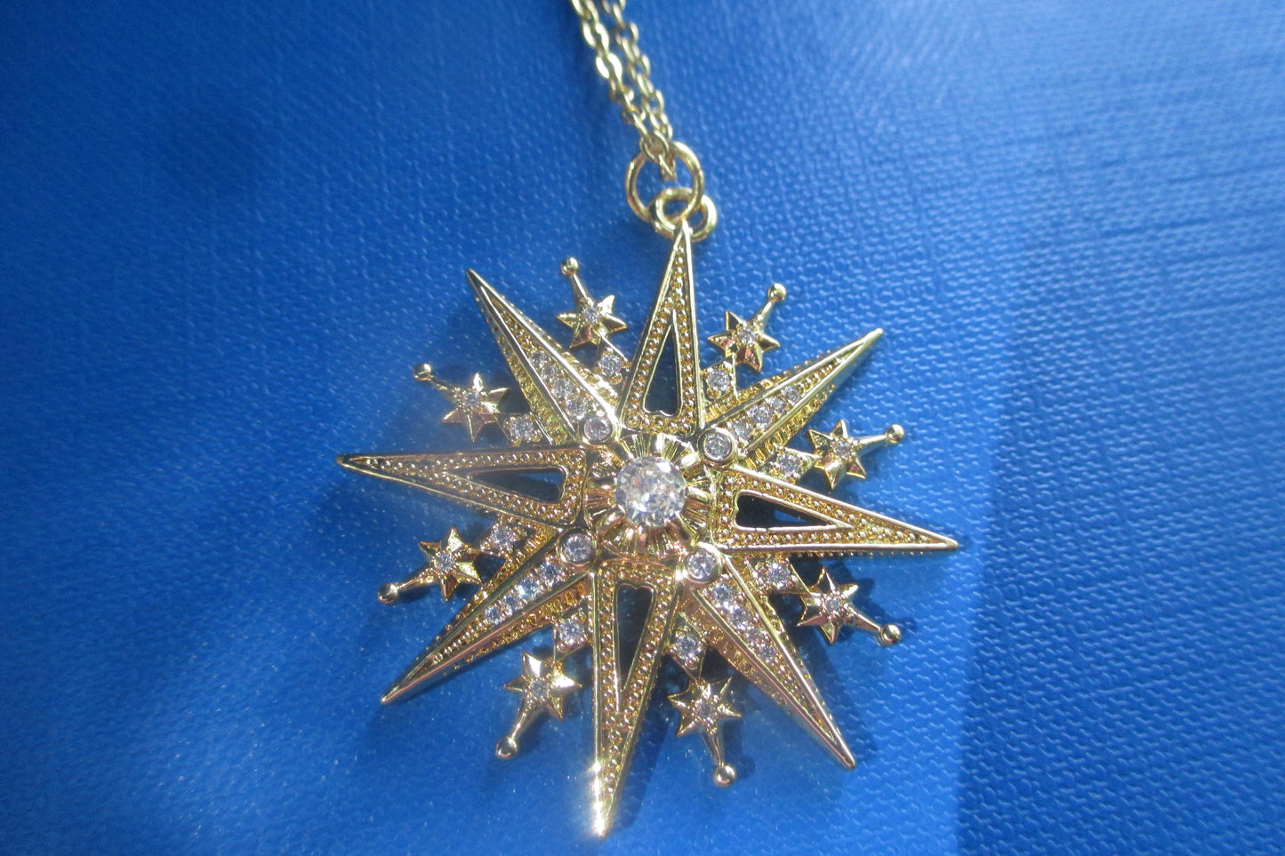 Gold star pendant