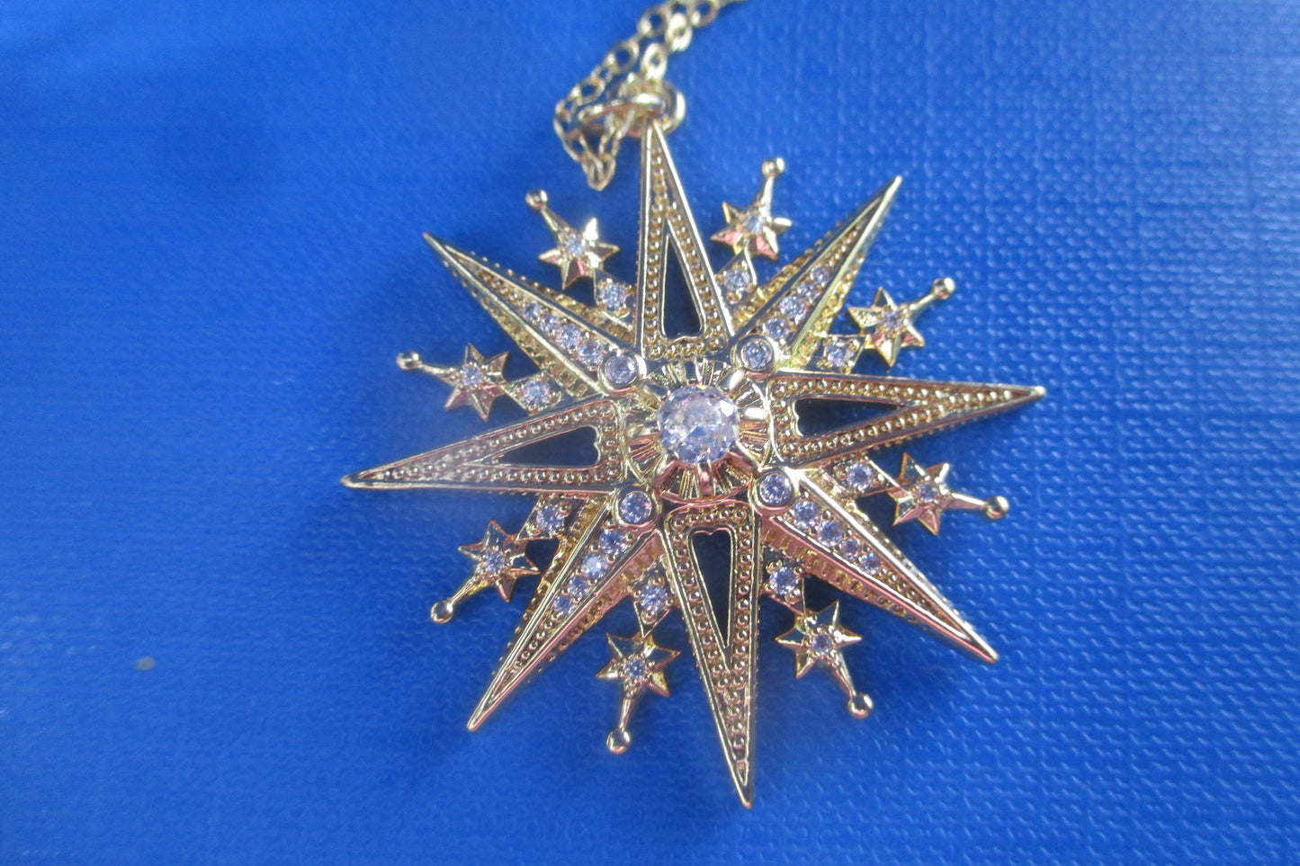 Gold star pendant