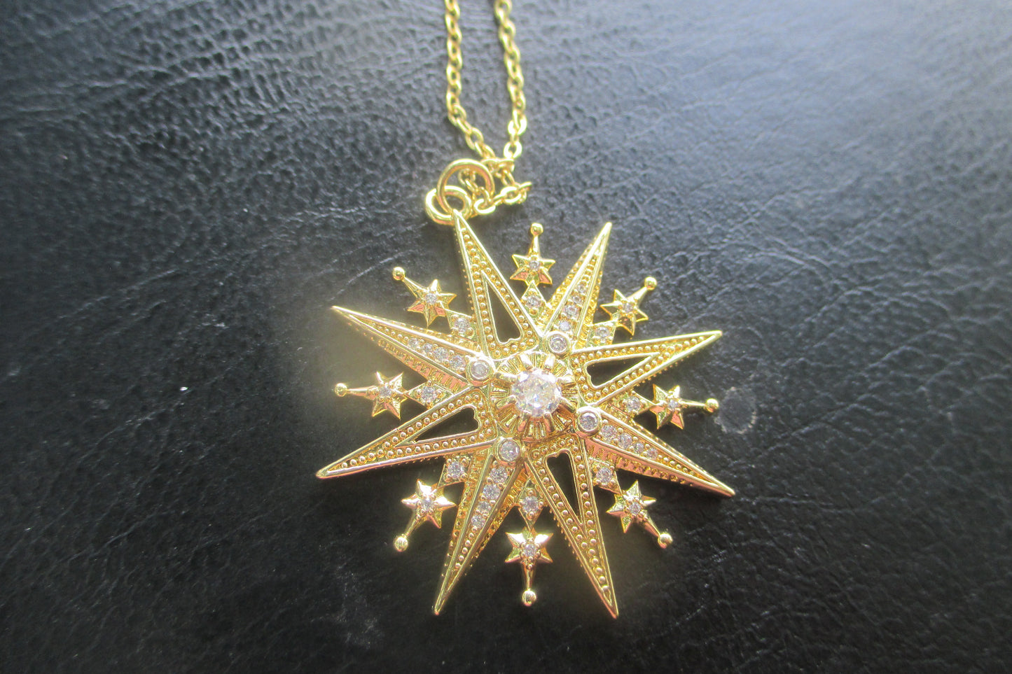 Gold star pendant