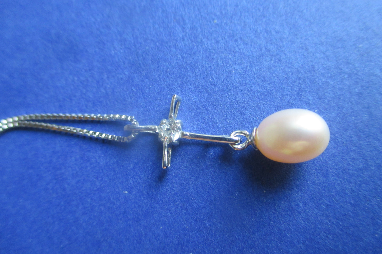 Pink pearl cross pendant