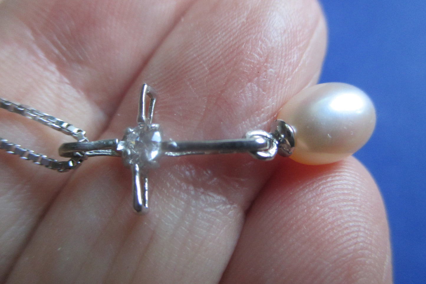 Pink pearl cross pendant