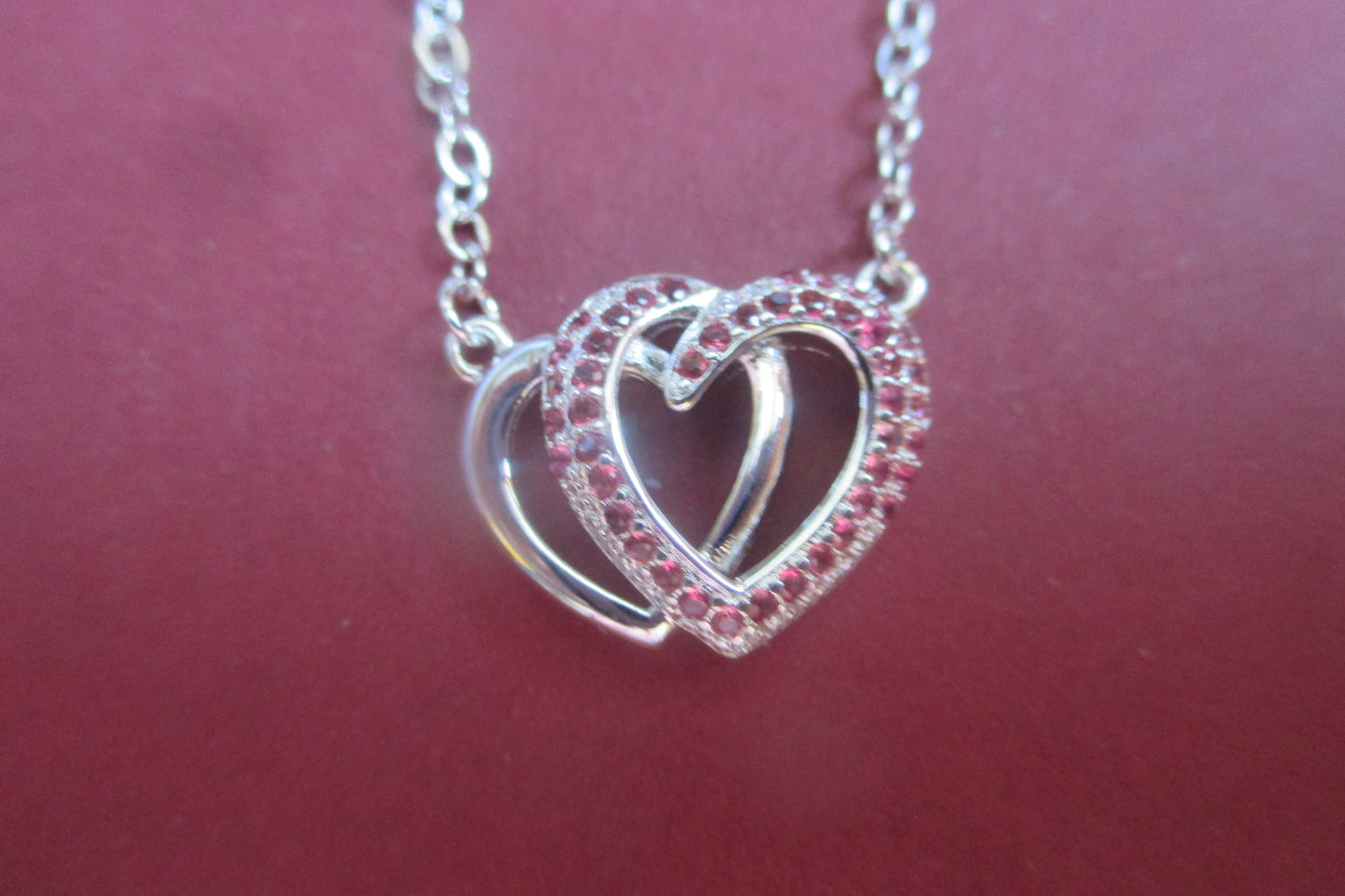 Silver hearts with red accents pendant